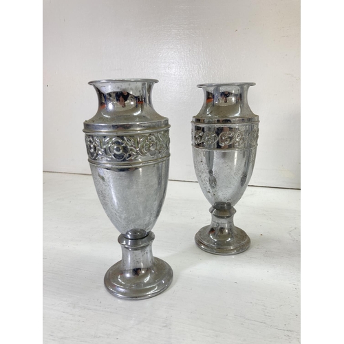 202 - Five vintage chrome plated vases, four 20cm high with floral design and one 26cm high