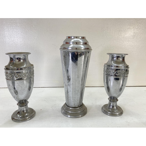 202 - Five vintage chrome plated vases, four 20cm high with floral design and one 26cm high