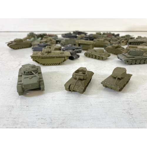 251 - A large collection of vintage metal diecast military vehicles to include Comet Authenticast etc.