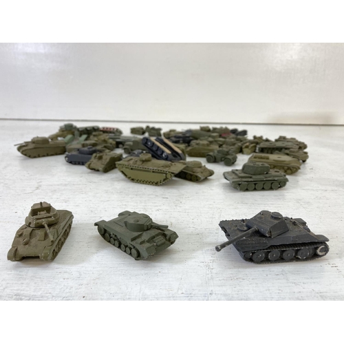 251 - A large collection of vintage metal diecast military vehicles to include Comet Authenticast etc.