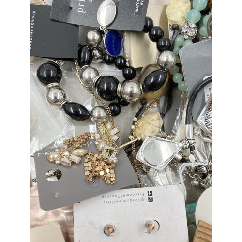 258 - A box containing a large quantity of assorted costume jewellery to include necklaces, cufflinks, Wal... 