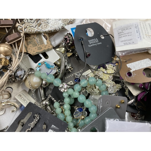 258 - A box containing a large quantity of assorted costume jewellery to include necklaces, cufflinks, Wal... 