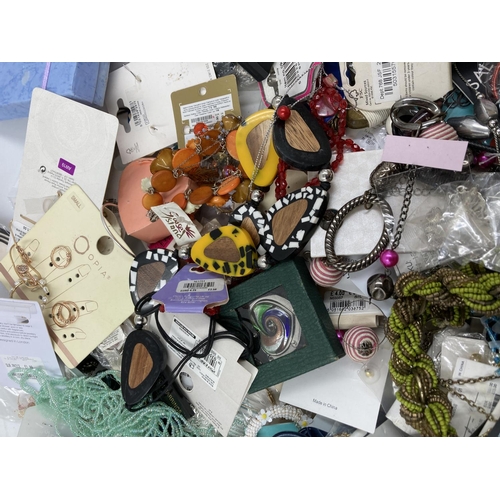 259 - A box containing a large quantity of assorted costume jewellery to include necklaces, earrings, Doro... 