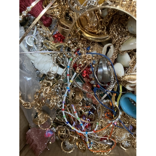 267 - A box containing a large quantity of assorted costume jewellery