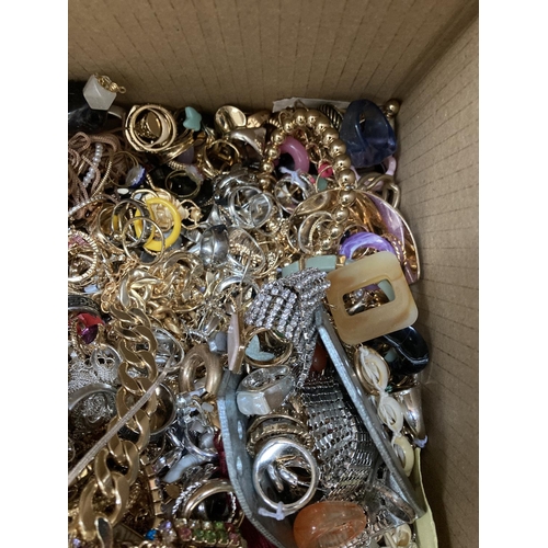 267 - A box containing a large quantity of assorted costume jewellery