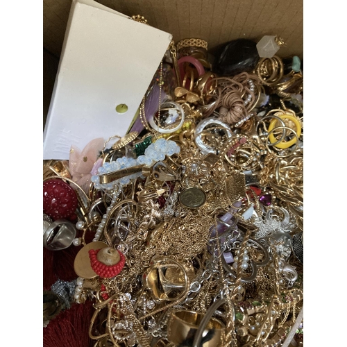 267 - A box containing a large quantity of assorted costume jewellery