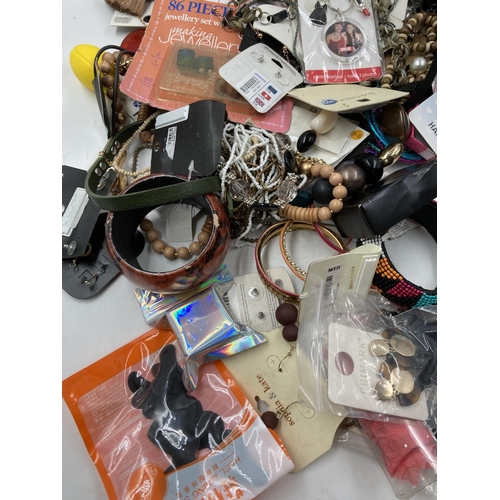 279 - A large quantity of assorted costume jewellery to include bangles, necklaces, bracelets etc.