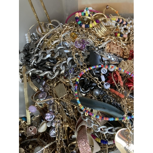 284 - A box containing a large quantity of assorted costume jewellery