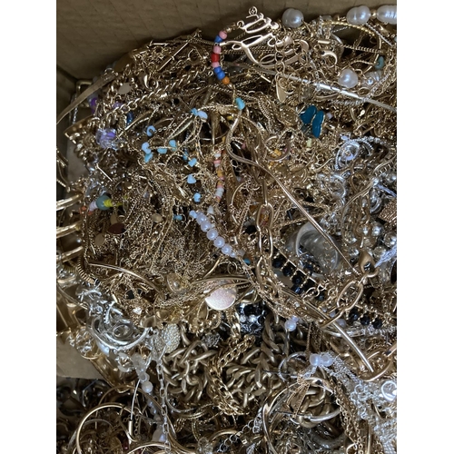 285 - A box containing a large quantity of assorted costume jewellery