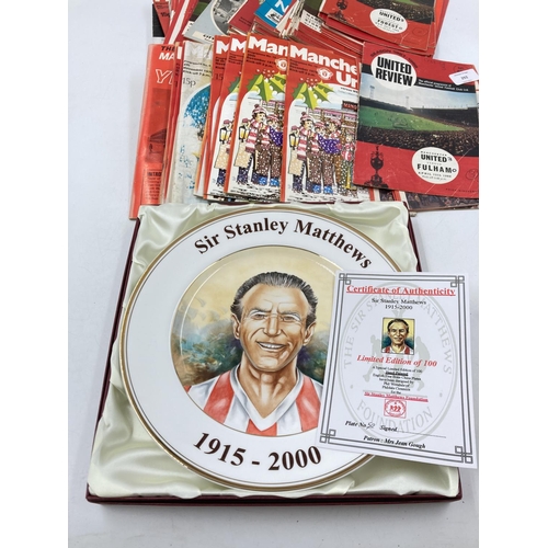 292 - A collection of Manchester United ephemera to include 1960s/70s match day programs and a boxed Worsd... 