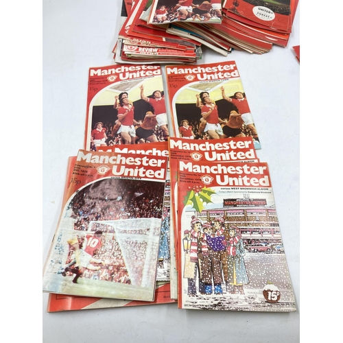 292 - A collection of Manchester United ephemera to include 1960s/70s match day programs and a boxed Worsd... 