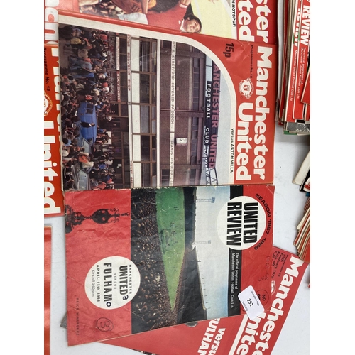 292 - A collection of Manchester United ephemera to include 1960s/70s match day programs and a boxed Worsd... 