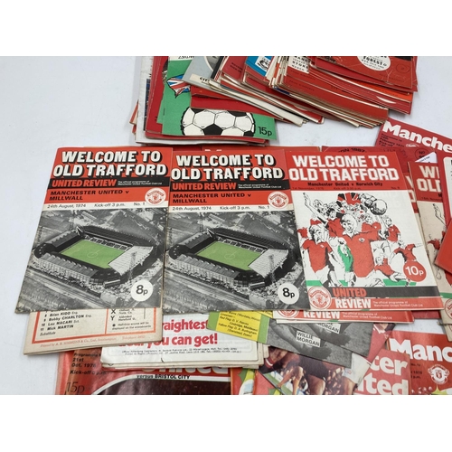 292 - A collection of Manchester United ephemera to include 1960s/70s match day programs and a boxed Worsd... 