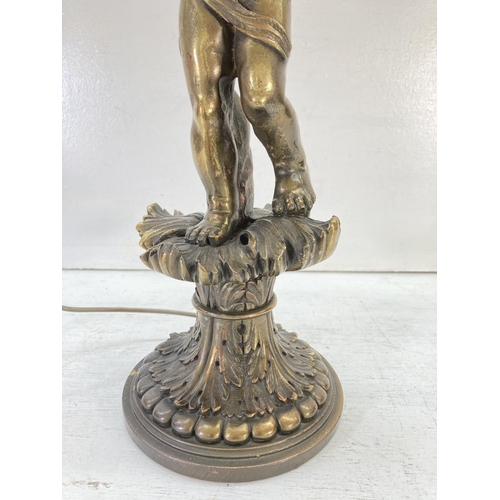 306 - A vintage French style bronzed cherub table lamp - approx. 55cm high