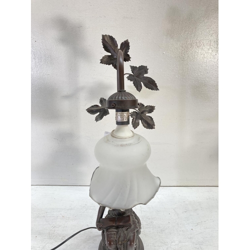 309A - An Art Nouveau style resin figural table lamp - approx. 60cm high