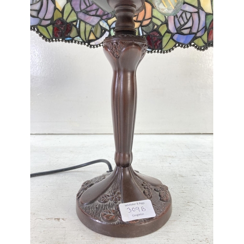 309B - A Tiffany style table lamp with rose design - approx. 40cm high and shade approx. 27cm diameter