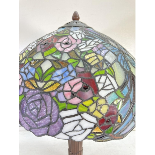 309D - A Tiffany style table lamp with butterfly and rose design - approx. 65cm high and shade approx. 40cm... 