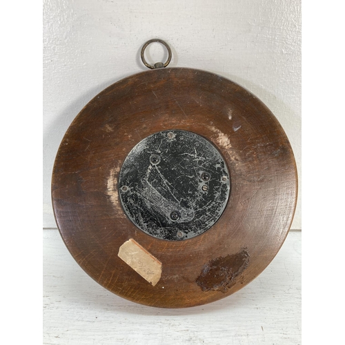 313 - A late 19th century carved walnut Aneroid barometer - approx. 21.5cm diameter