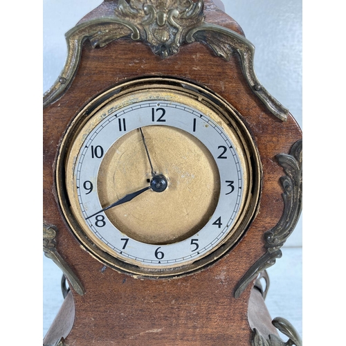 314 - A mid 20th century French style mahogany and gilt metal mantel clock