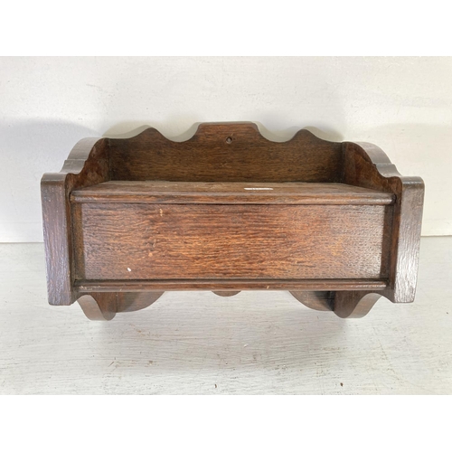 332 - An early/mid 20th century oak wall hanging candle box - approx. 20cm high x 29.5cm wide and 15cm dee... 