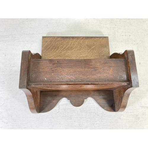 332 - An early/mid 20th century oak wall hanging candle box - approx. 20cm high x 29.5cm wide and 15cm dee... 