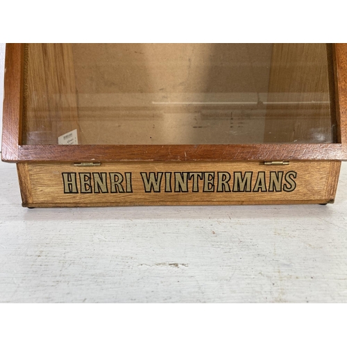 333 - A mid 20th century teak cased and glazed fronted Henri Wintermans advertising cigar display case - a... 