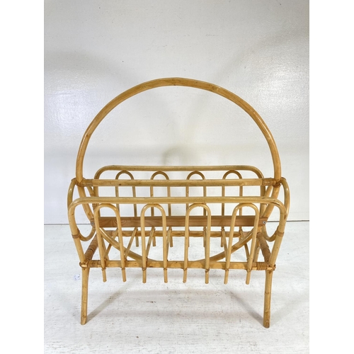 344 - A 1970s bamboo and cane magazine rack - approx. 57cm high x 47cm wide