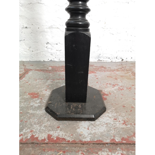 358 - A mid 20th century black painted reeded column torchère - approx. 98cm high