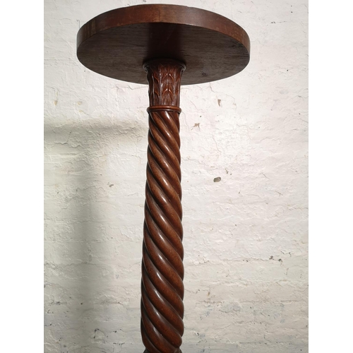 361 - An early/mid 20th century mahogany barley twist torchère - approx. 107cm high x 30cm in diameter