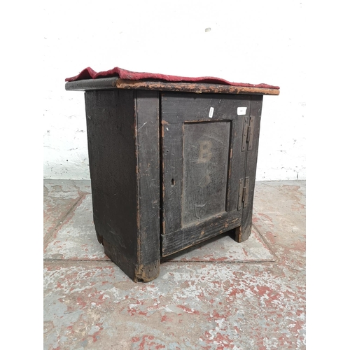 362 - A 19th century ecclesiastical pine cabinet with single door - approx. 50cm high x 55cm wide x 31cm d... 