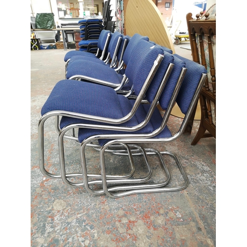 364 - Sixteen blue upholstered and chrome plated stacking chairs