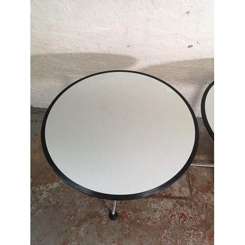 372 - Two modern grey laminate circular bistro tables with metal pedestal supports - approx. 74cm high x 8... 