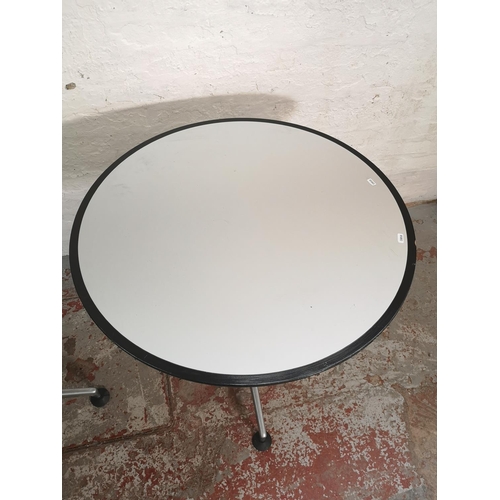 372 - Two modern grey laminate circular bistro tables with metal pedestal supports - approx. 74cm high x 8... 