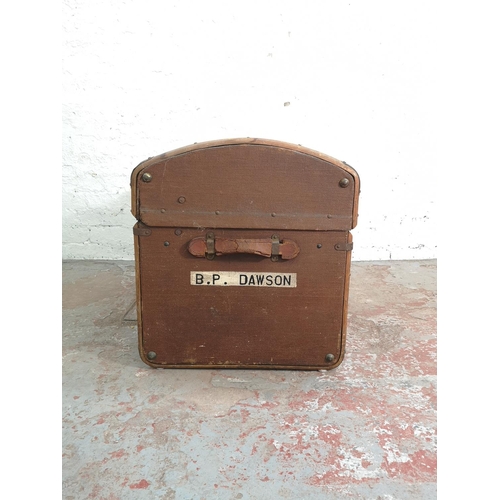 375 - An early 20th century wooden banded brown canvas travel trunk with contents - approx. 58cm high x 76... 