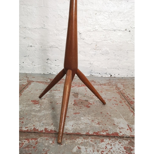 380 - A mid 20th century teak and brass floor lamp - approx. 145cm high