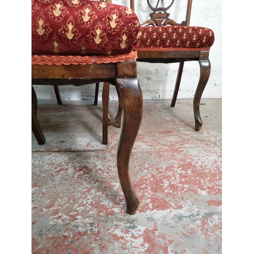 386 - A set of four Edwardian mahogany dining chairs with red upholstery