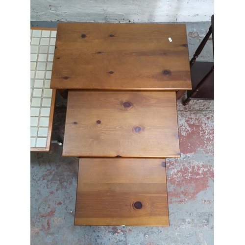 387 - Three pieces of furniture comprising pine nest of three tables, mahogany effect two tier side table ... 