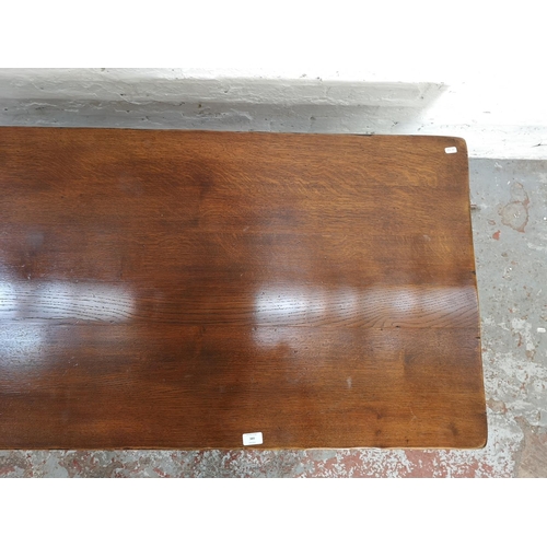 389 - A 17th century style solid oak rectangular coffee table with lower stretcher - approx. 49cm high x 6... 