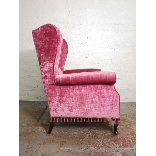 397 - A Victorian style pink upholstered wing back armchair - approx. 102cm high x 76cm wide x 69cm deep