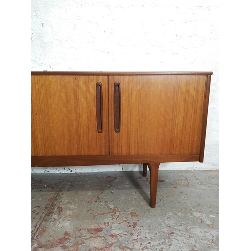 399 - A Nathan teak sideboard with three drawers and two cupboard doors - approx. 75cm high x 185cm wide x... 