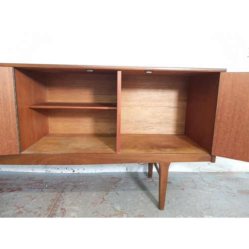 399 - A Nathan teak sideboard with three drawers and two cupboard doors - approx. 75cm high x 185cm wide x... 