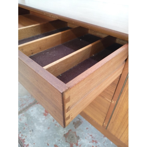 399 - A Nathan teak sideboard with three drawers and two cupboard doors - approx. 75cm high x 185cm wide x... 