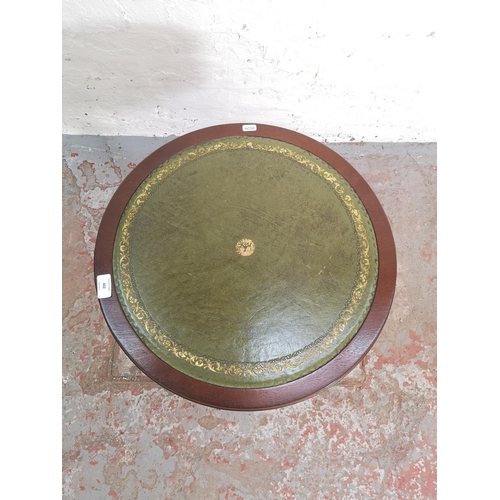 402 - A Regency style mahogany drum table with green leather insert and brass lion paw feet - approx. 59cm... 