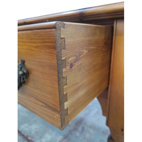 404 - A Country Furniture Workshop pine two drawer console table - approx. 81cm high x 141cm wide x 53cm d... 