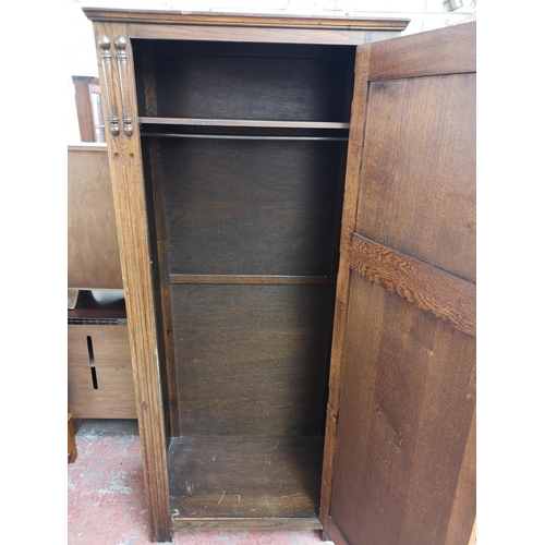 406 - A mid 20th century oak single door wardrobe - approx. 181cm high x 80cm wide x 47cm deep