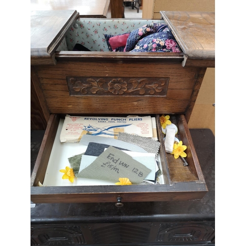 409 - Two pieces of mid 20th century oak furniture, one sewing box - approx. 58cm high x 41cm wide x 31cm ... 