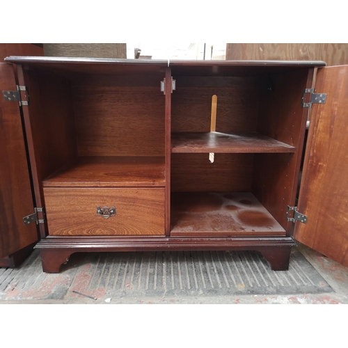 410 - Four pieces of mahogany effect furniture comprising two door media cabinet, Georgian style two tier ... 