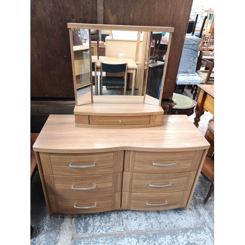 413 - An Alston's Furniture walnut effect chest of six drawers with matching dressing table mirror - appro... 