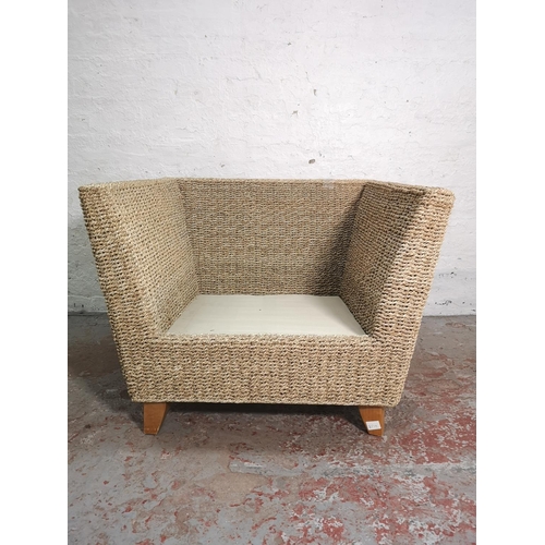 421 - A modern wicker armchair with beige upholstered cushions - approx. 71cm high x 95cm wide x 86cm deep