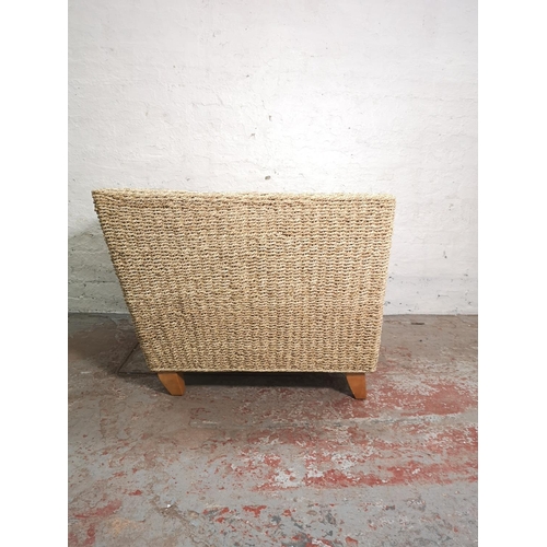 421 - A modern wicker armchair with beige upholstered cushions - approx. 71cm high x 95cm wide x 86cm deep